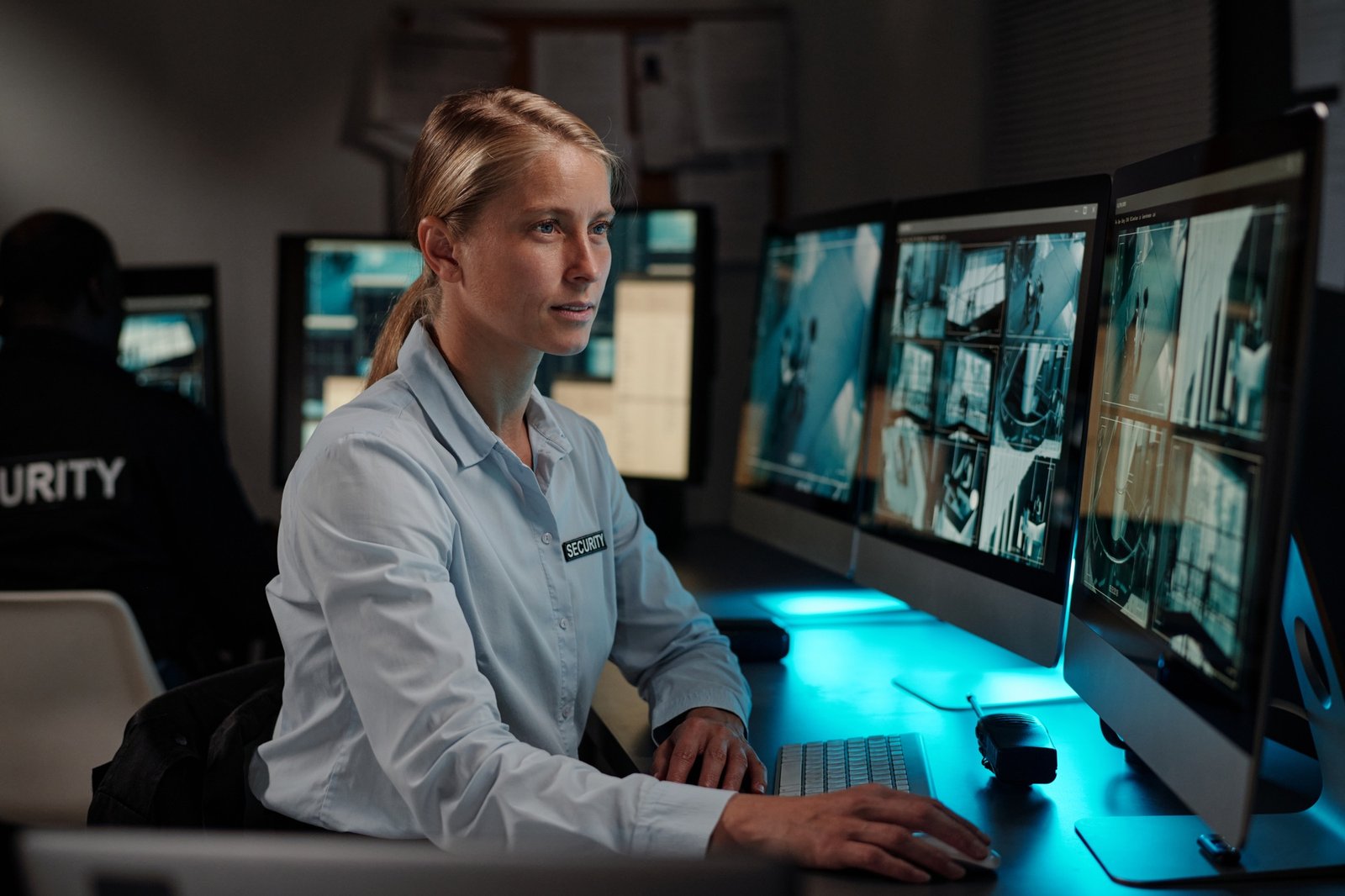 Blond female security guard in uniform